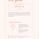 Size guide for children's hats with measurement instructions on a light pink background